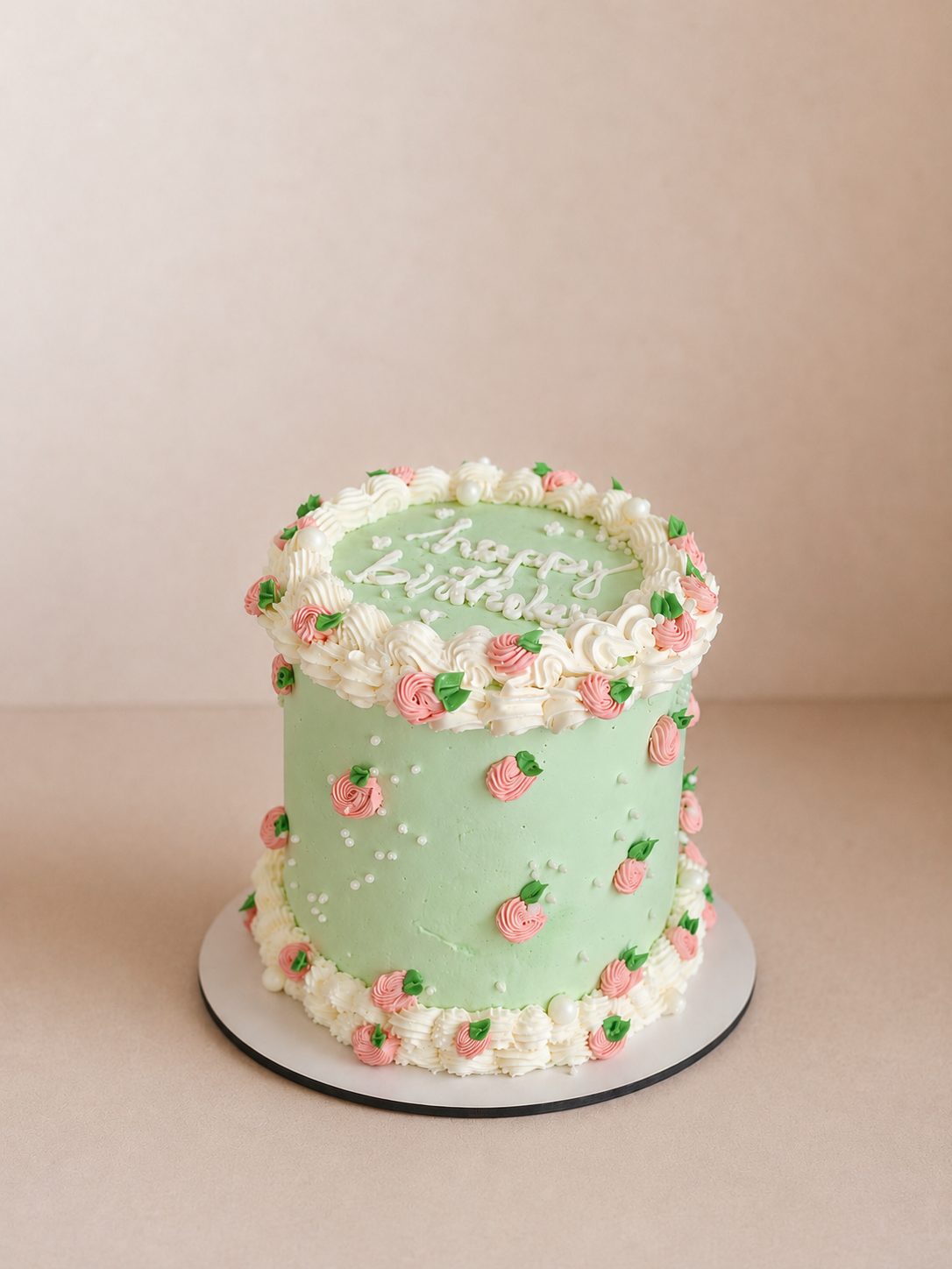 Torta compleanno verde con fiori rosa, Milka Sweet Cakes