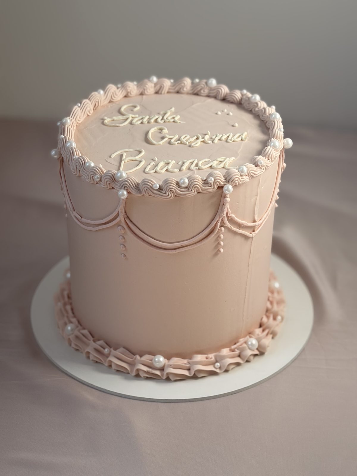 Torta comunione personalizzata rosa cipria, Milka Sweet Cakes